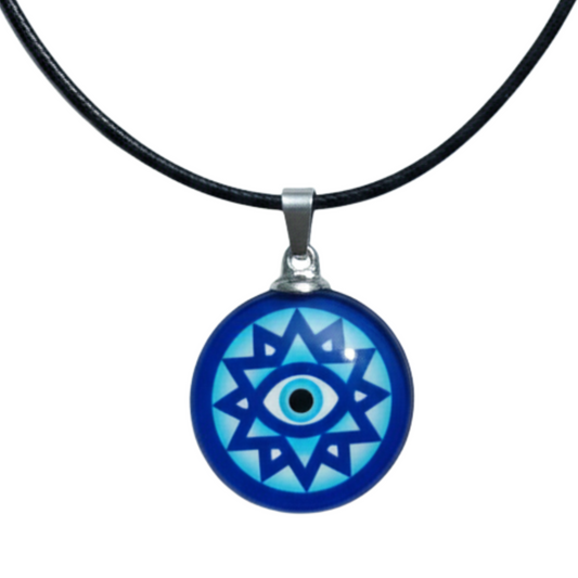 Blue evil eye pendant on a black cord against a white background