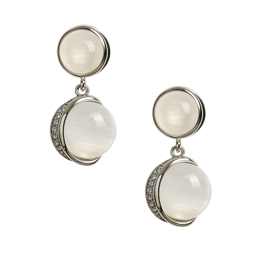 Pair of silver earrings with round white stones on a white background