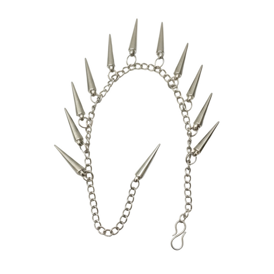 Silver chain with spike attachments on a white background