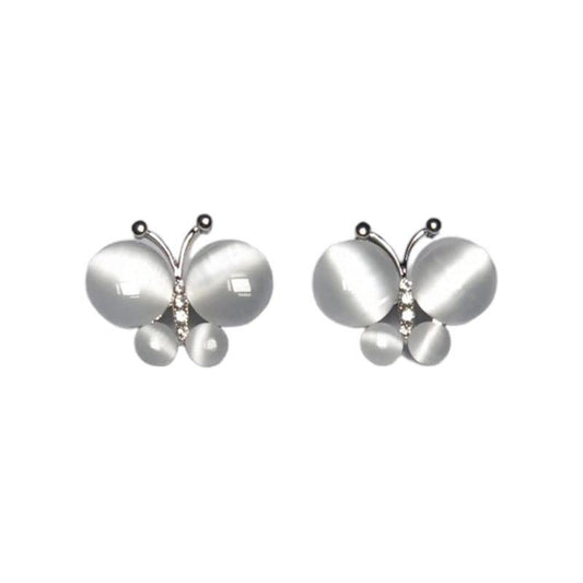 Butterfly-shaped earrings with pearl accents on a white background