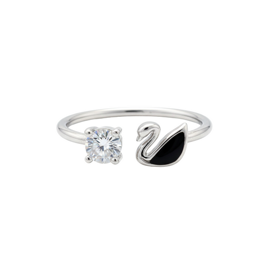 Silver ring with a swan design and clear gemstone on a white background