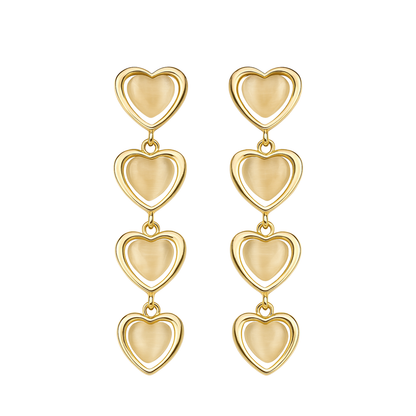 Gold heart-shaped earrings on a white background