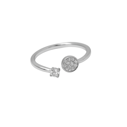 Silver ring with a small round gemstone and a larger round gemstone on a white background