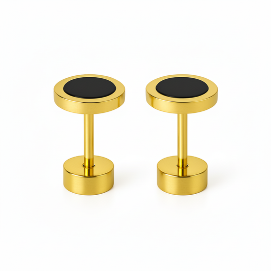 Pair of gold cufflinks with black centers on a white background