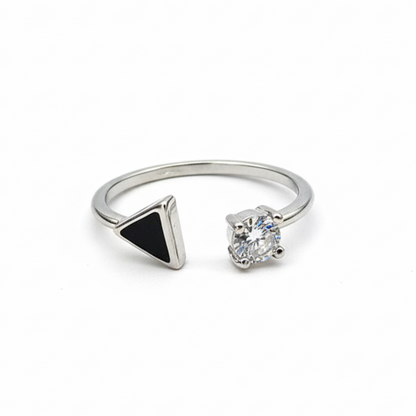 Two rings with a black triangle and clear gemstone on a white background