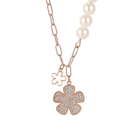 Necklace with rose gold flower pendants and pearl beads on a white background