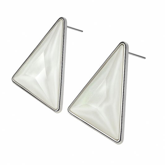 Triangular earrings with a white stone on a white background