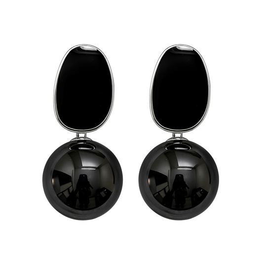Black spherical earrings with a smaller black oval on top against a white background