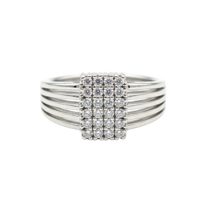 Silver ring with diamond accents on a white background