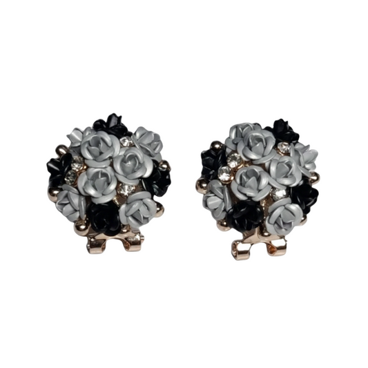 Pair of floral earrings with black and gray flowers on a white background