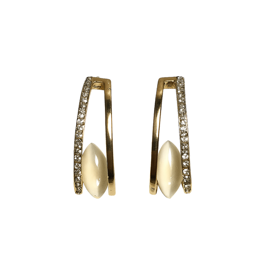 Gold hoop earrings with pearl-like centers on a white background