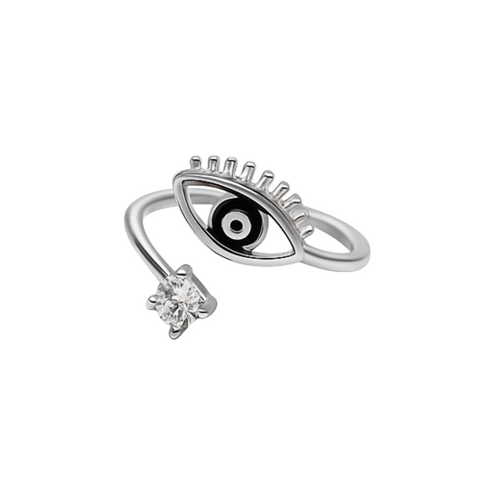 Silver ring with eye design and small diamond on a white background