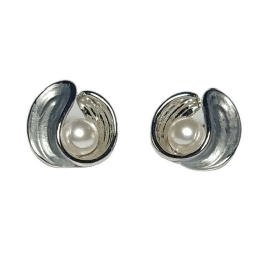 Pair of silver earrings with pearl centers on a white background