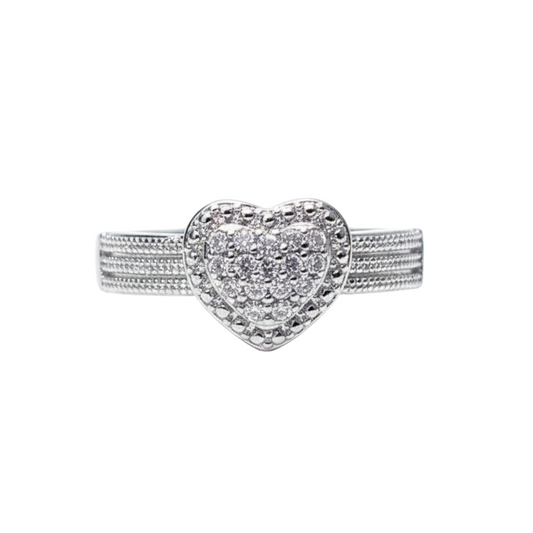 Silver heart-shaped ring with embedded stones on a white background