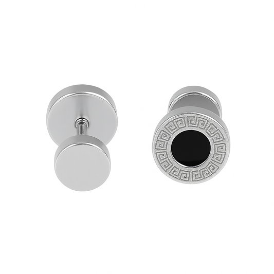 Pair of silver cufflinks with one featuring a black center and intricate design on a white background