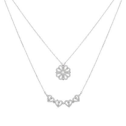Silver necklace with a floral pendant on a white background