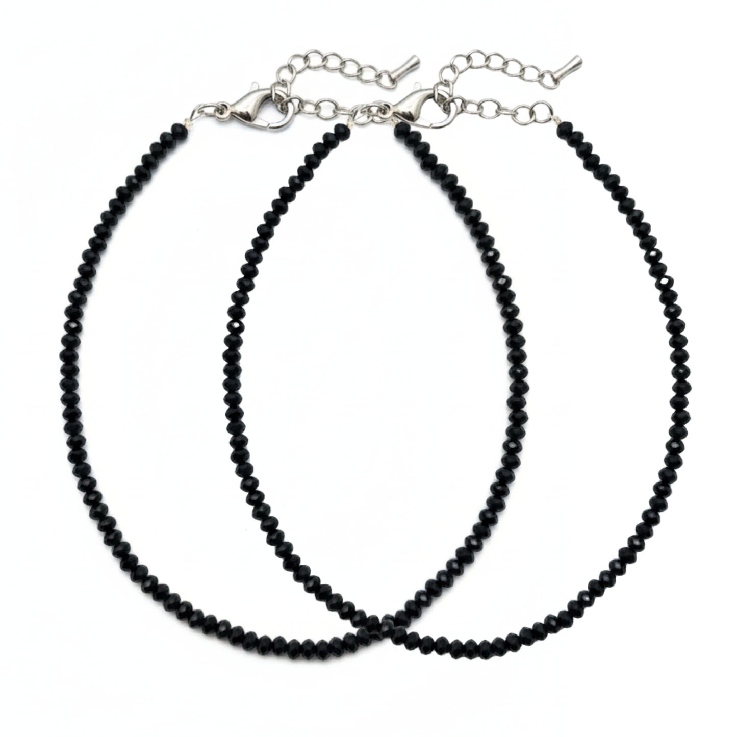 Two black beaded necklaces on a white background