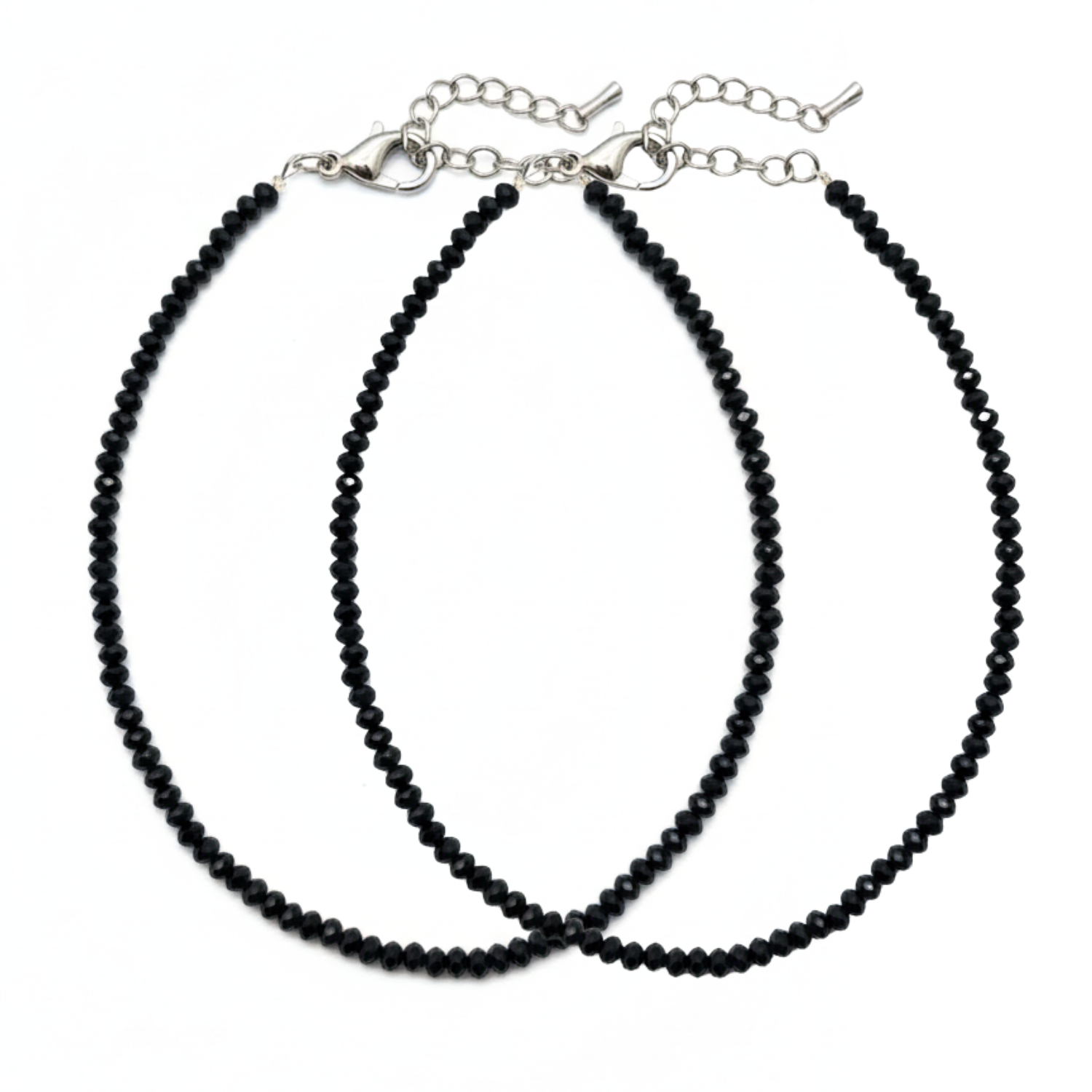 Two black beaded necklaces on a white background