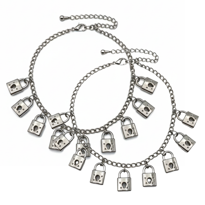 Silver chain bracelet with padlock charms on a white background