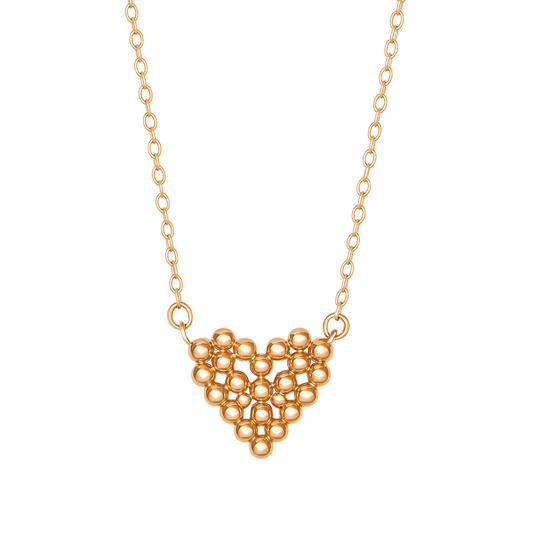 Gold necklace with a geometric heart pendant on a white background