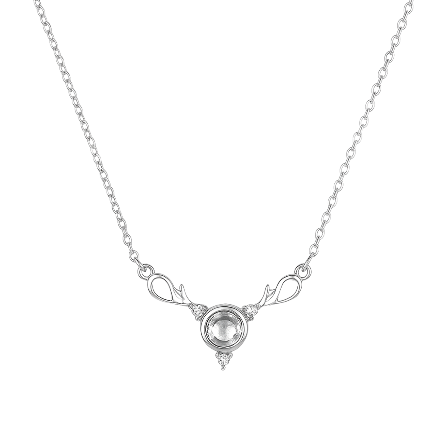 Silver necklace with a clear gemstone on a white background