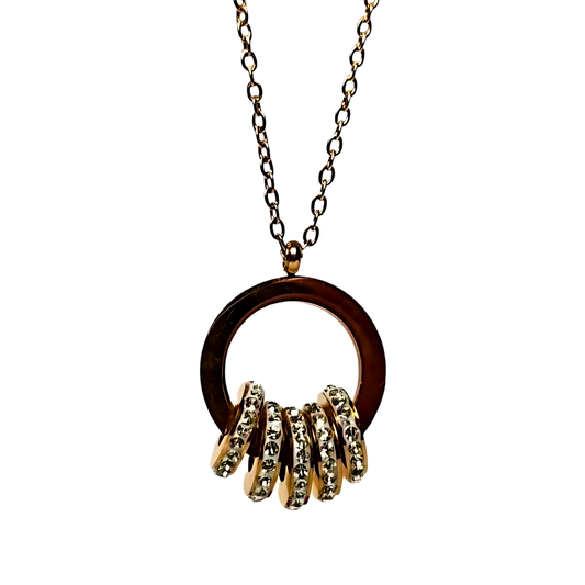 Necklace with a stainless steel pendant and gold rings on a white background