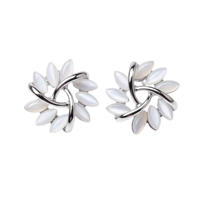 Pair of silver earrings with white stones on a white background