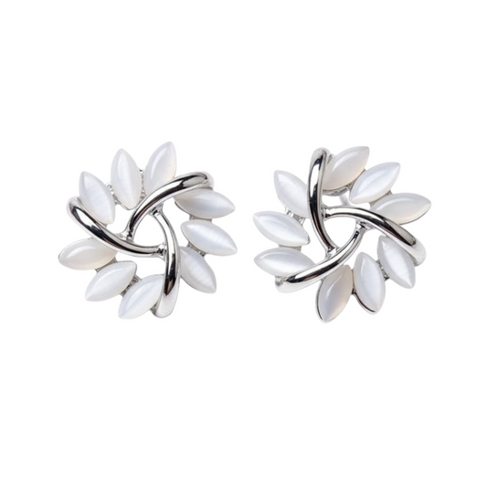 Pair of silver earrings with white stones on a white background
