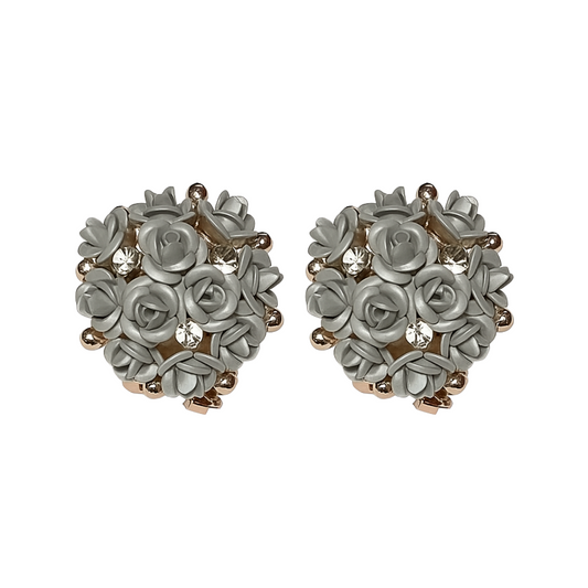 Heart-shaped earrings with floral design on a white background