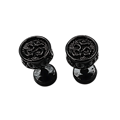 Pair of black om decorative knobs on a white background