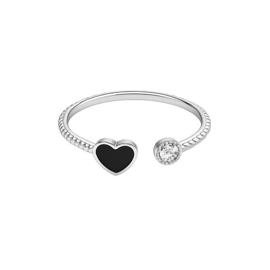 Silver ring with a heart-shaped black stone and a small diamond on a white background