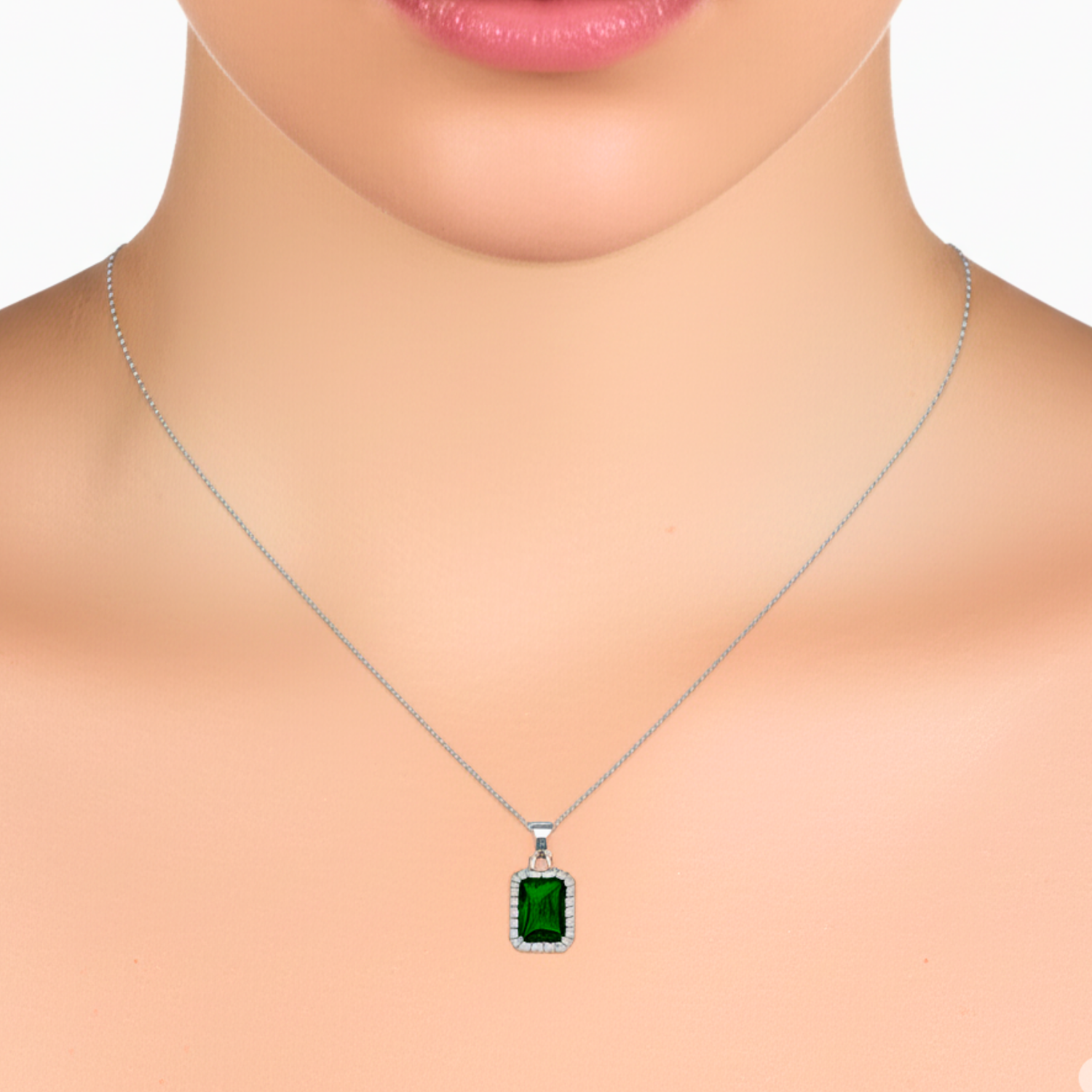 Green gemstone necklace on a mannequin with a white background
