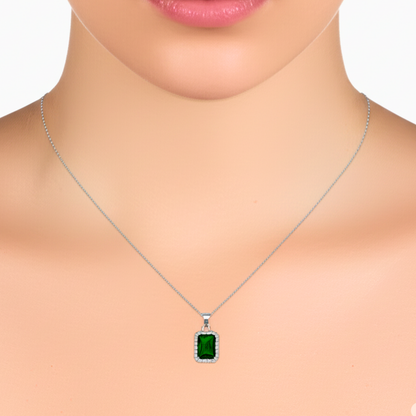 Green gemstone necklace on a mannequin with a white background