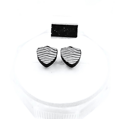 Black and white striped earrings on a white background