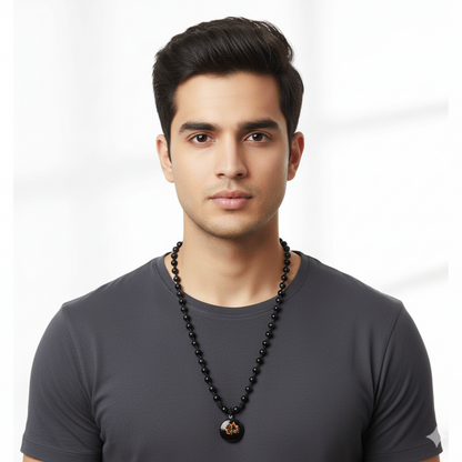 Man wearing a black beaded necklace on a white background