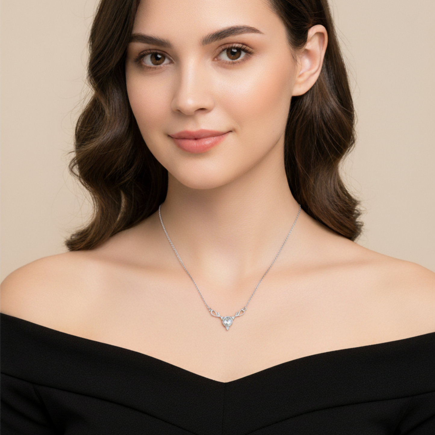 Woman wearing a silver necklace with a heart-shaped pendant on a beige background