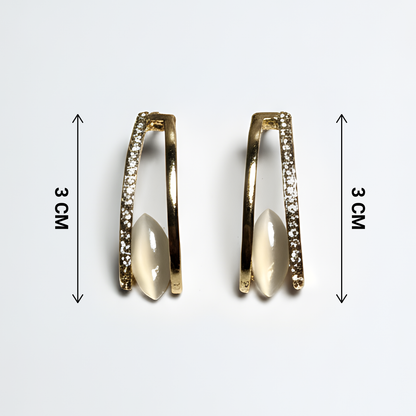 Gold hoop earrings with embedded stones and measurements on a white background