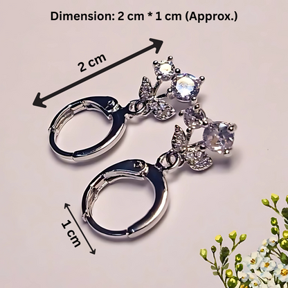Silver keychain with gemstones and dimensions indicated on a light background