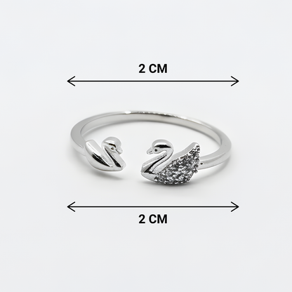 Silver swan-shaped ring with measurements on a white background