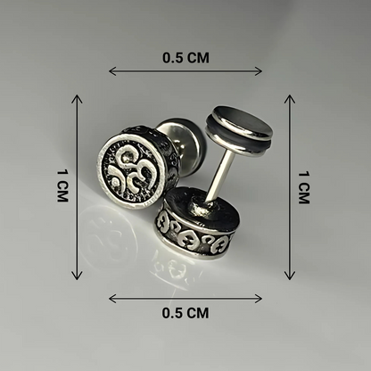 Silver stud earrings with measurements on a gray background