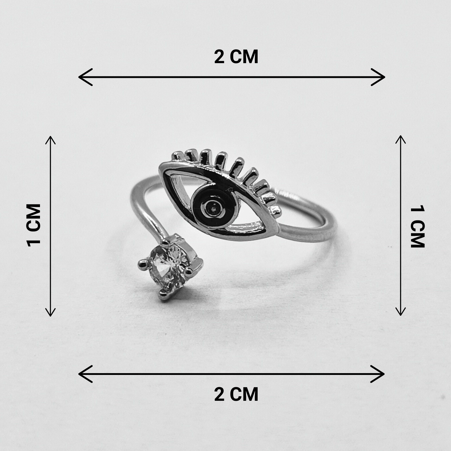 Black eye and diamond ring with measurement in grey background