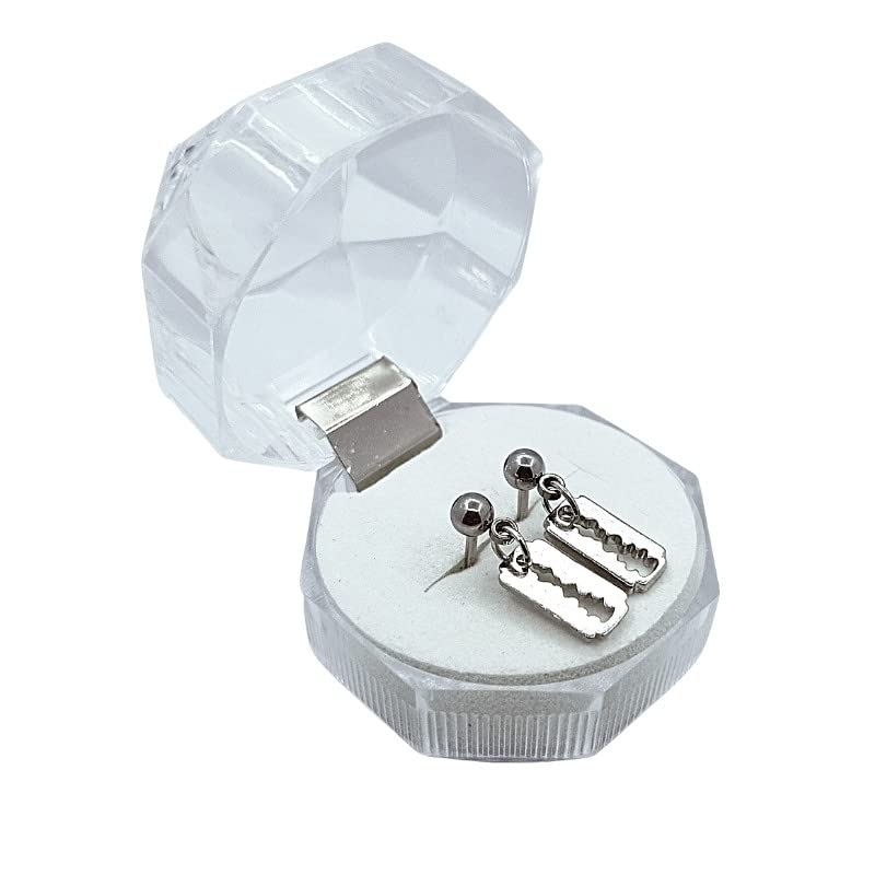 Silver earrings in a clear crystal box on a white background