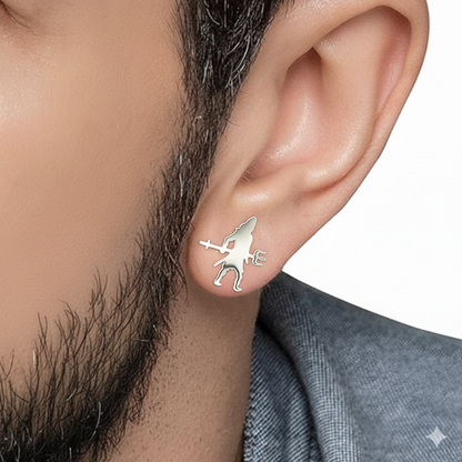 Silver earring worn by a person with a neutral background