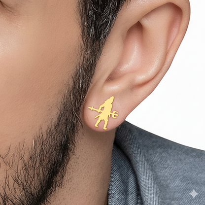 Gold earring worn by a person with a neutral background