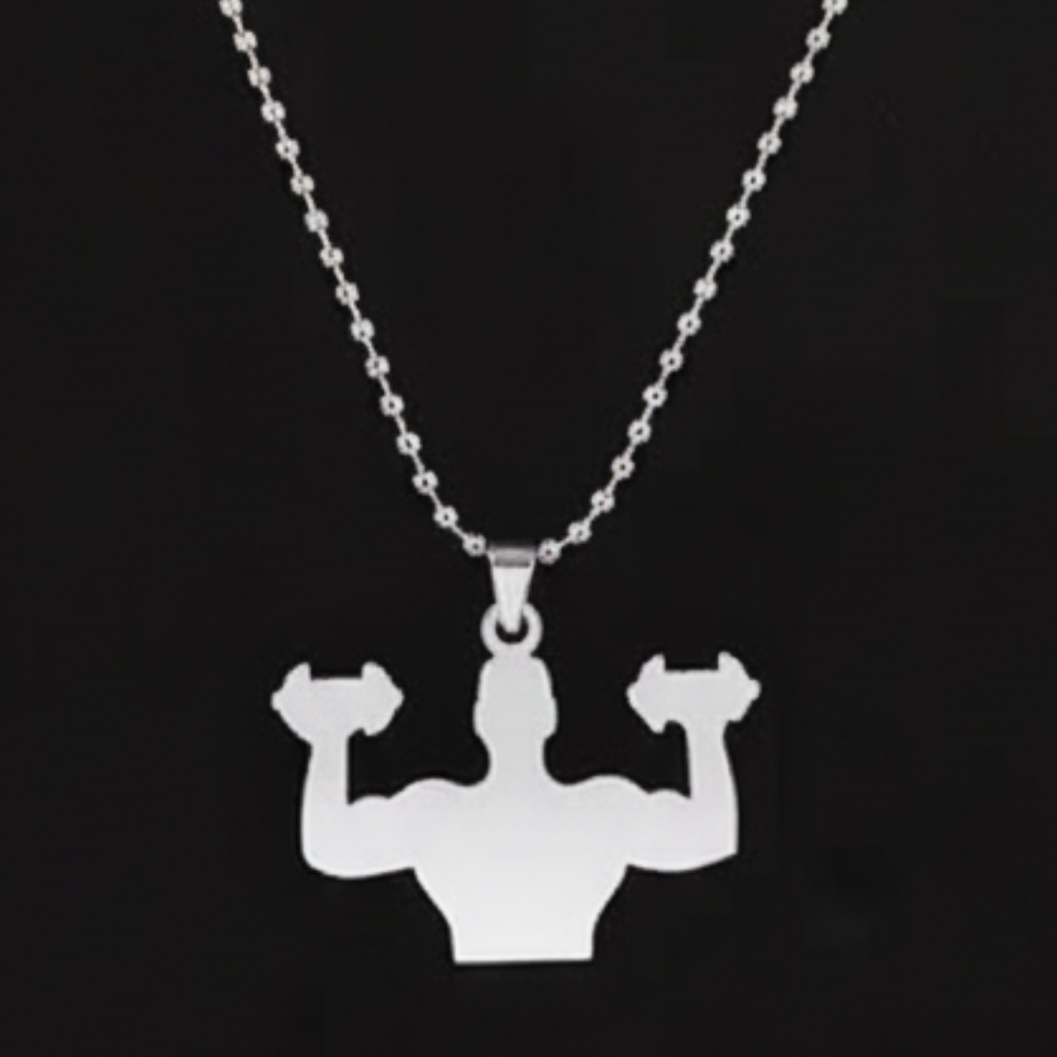 Silver necklace with a pendant of a muscular figure lifting weights on a black background