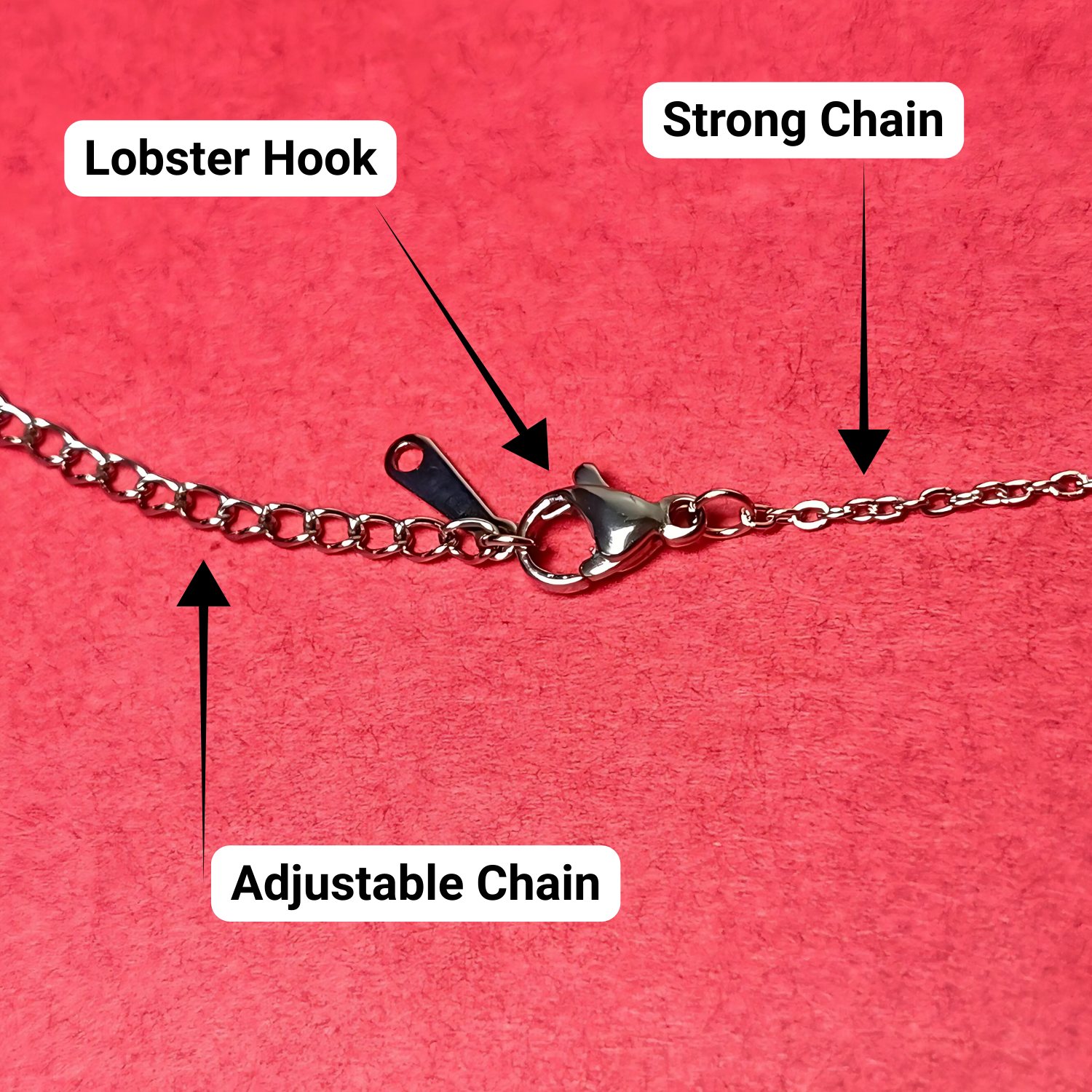 Chain necklace with labeled lobster hook, strong chain, and adjustable chain on a red background
