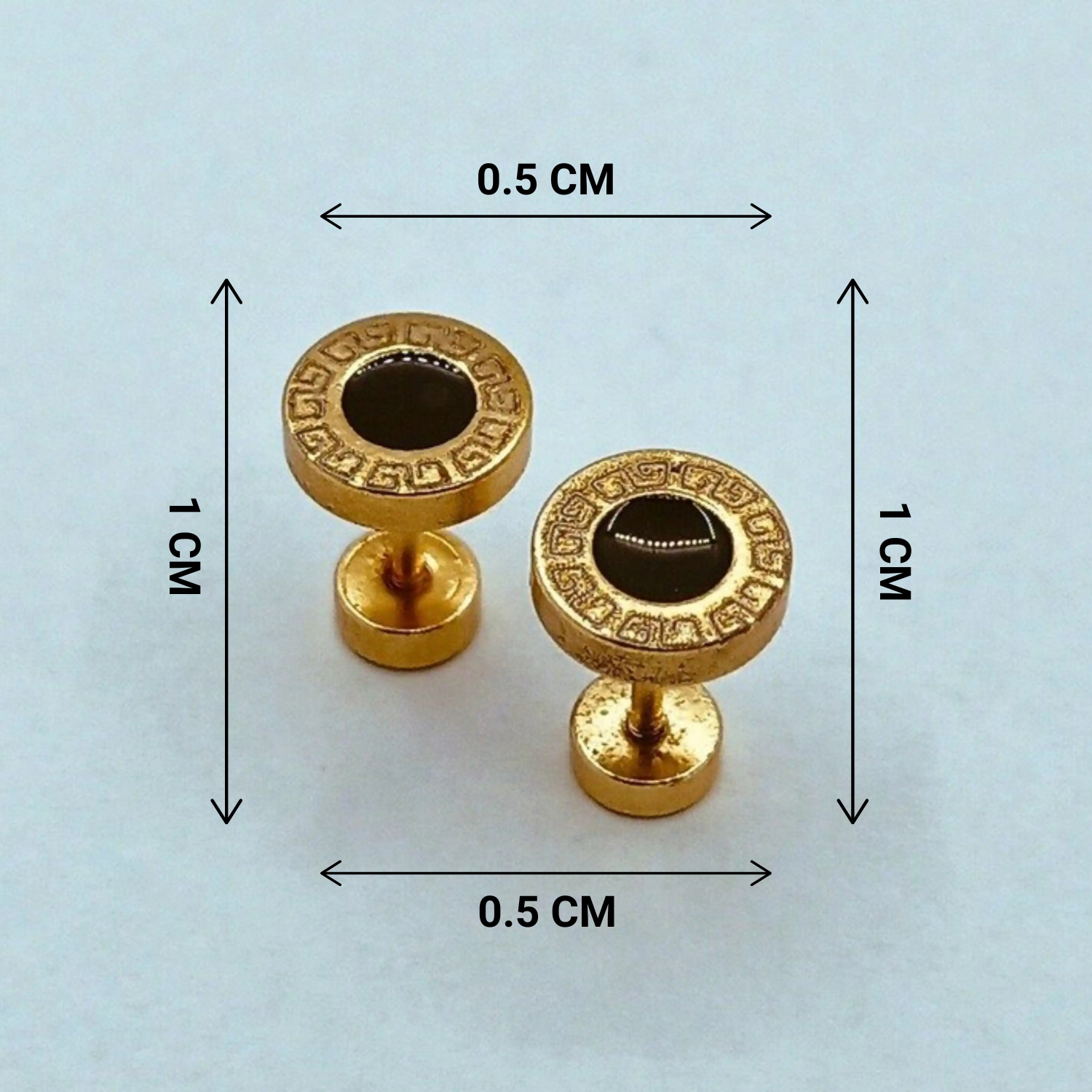 Gold earrings with decorative patterns and measurements on a light blue background