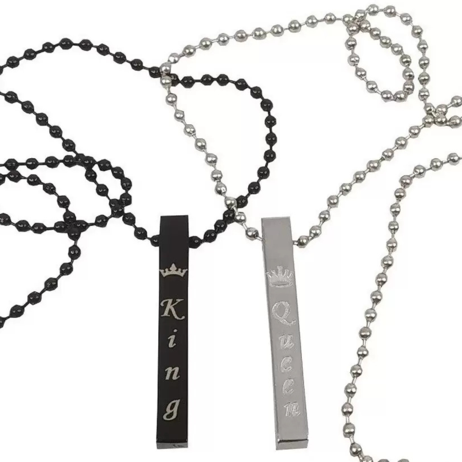 Two necklaces with 'King' and 'Queen' pendants on a white background