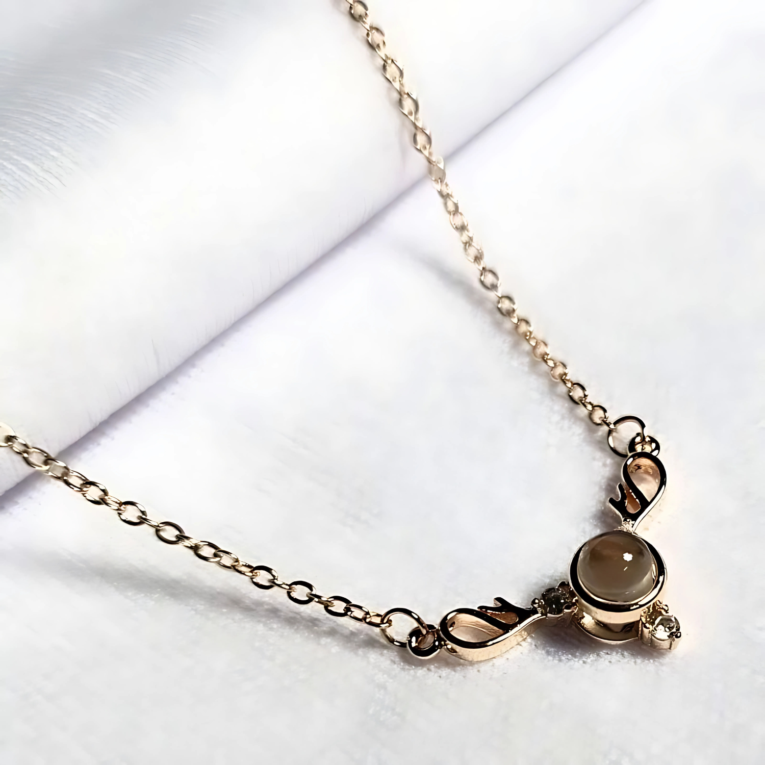 Gold bracelet with a clasp on a white background