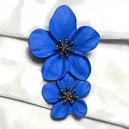 Blue flower-shaped brooch on a textured white background